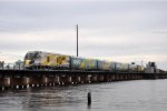 Southbound Brightline eases across the bridge